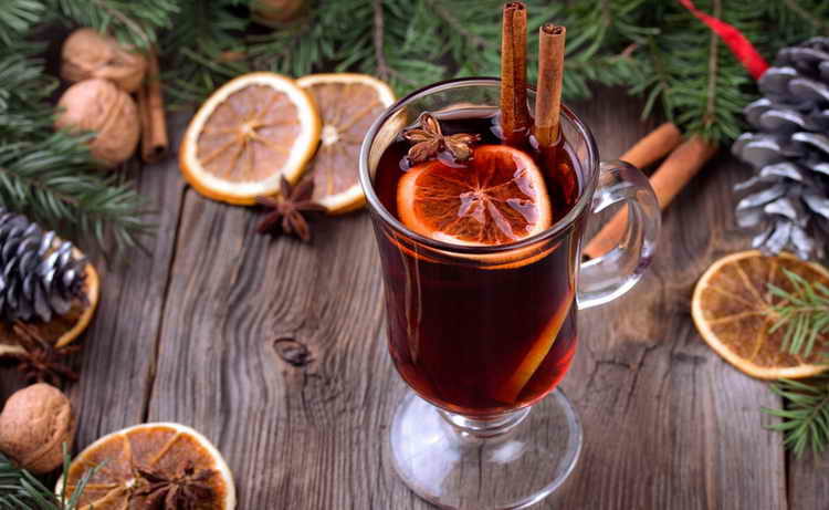 mulled-wine-sliced-dried-orange-cinnamon-sticks-anise-stars-and-candle-with-pine-brunch